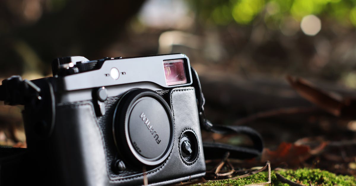 Selective Focus Photo of Black Fujifilm Camera on Ground