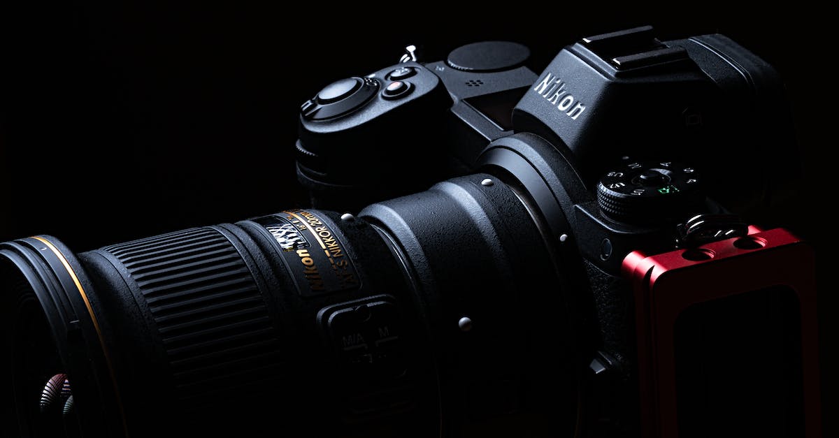 Black Nikon Dslr Camera on Black Surface